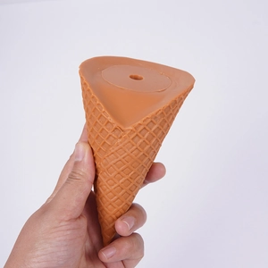Realistic brown waffle ice cream cone prop with textured grid and hole on a white background