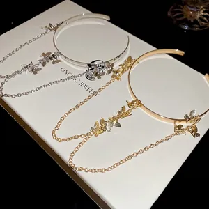 Metallic butterfly tassel chain open armlet in gold and silver finish with fine detail