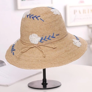 Lafite straw sun hat with floral embroidery and blue wave pattern for summer beach vacations