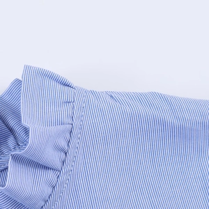 Detail of blue and white striped poplin fabric featuring delicate ruffle pleats
