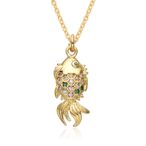 Close-up of golden turtle pendant with colorful micro-set cubic zirconia on a fine chain