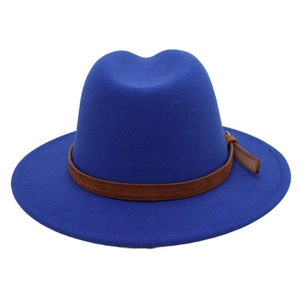 Close-up of royal blue wool fedora hat featuring a brown leather belt buckle strap detail