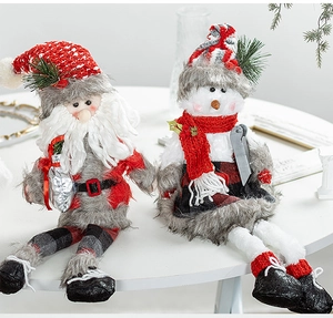 Close-up of plush Santa and Snowman shelf sitters with long legs for Christmas decor