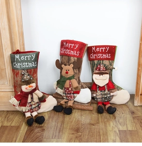 Detail of Christmas stockings with 3D snowman, reindeer, and Santa Claus figures
