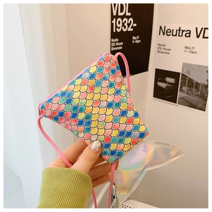 Detail shot of a creative mermaid tail mini bag featuring colorful holographic scales