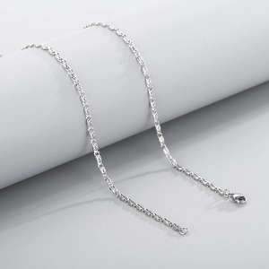 Detailed macro view of a silver stainless steel paperclip chain with lobster clasp
