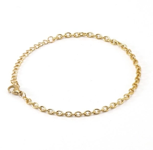 Detailed close-up of a golden metal chain bracelet featuring a secure lobster clasp