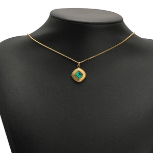 French style gold chain necklace with a square green gemstone in a round pendant
