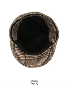 Detail view of the warm black plush lining inside this vintage houndstooth beret hat