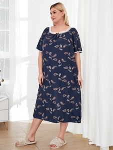 Detail view of the intricate lace neckline and paisley print on the plus size nightgown