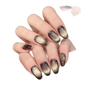 Deep golden brown cat-eye press-on nails in long oval shape with metallic glitter finish