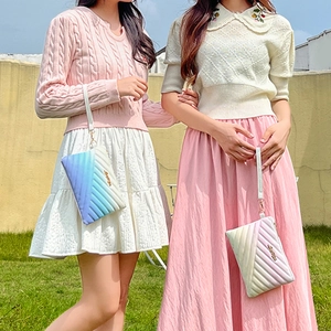 Rainbow gradient striped clutch bags with quilted pattern and gold hardware accents