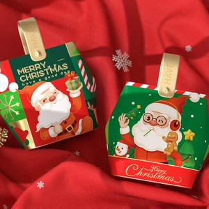 Christmas gift boxes with Santa Claus and gingerbread designs with golden handles