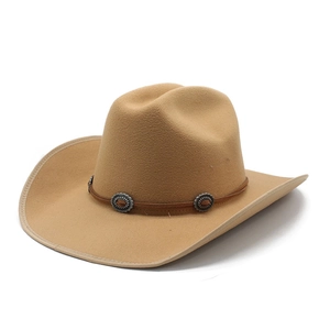 Detail of light brown felt western cowboy hat with leather band and vintage metal conchos