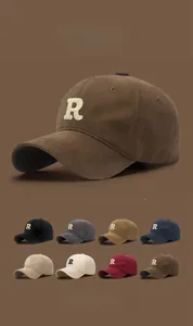 Detailed view of R letter embroidery on baseball caps in eight various colors