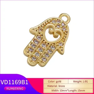 Gold plated brass Hamsa Hand pendant with cubic zirconia and heart cutout detail