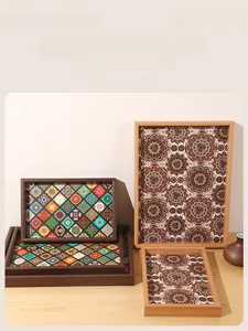 Detail of bohemian rectangle wooden trays with vintage mandala patterns and walnut frames
