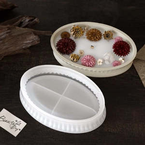 Striped oval silicone mold for resin candle cups and trays with floral dried flower inlay