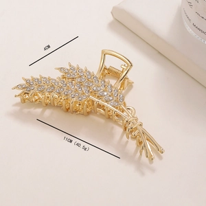 Detail view of 11cm gold wheat hair claw clip with white rhinestones and size labels