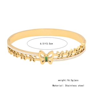 Detail of gold butterfly bangle in stainless steel with green stone and dimensions
