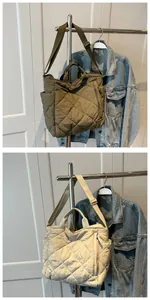 Close-up of quilted puffer tote bags in olive green and beige with adjustable straps