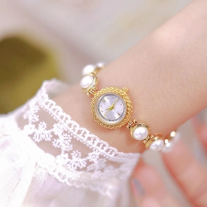 Elegant women's quartz watch with pearl bead bracelet strap and golden round case