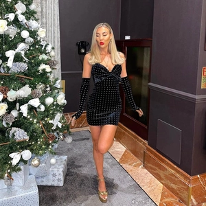 Sparkly black sequin velvet mini dress with bow detail and matching long gloves