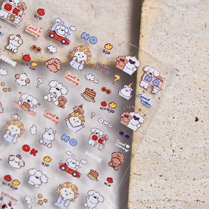 Detail showing transparent cartoon puppy stickers for scrapbooking and DIY decoration