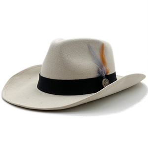 Beige wool fedora with black band, feathers and anchor metal badge on white background