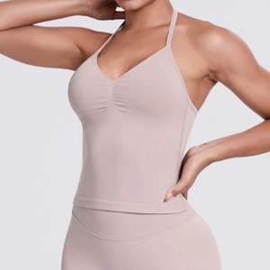 Detail of seamless V-neck yoga tank top with gathered chest and thin straps in beige