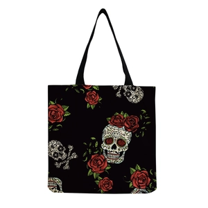 Detail of the high-quality canvas fabric with skull and red rose prints on the tote bag