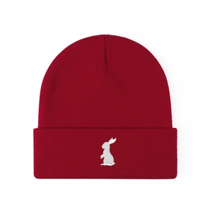 Deep red knitted beanie featuring a white rabbit embroidery and cozy ribbed texture