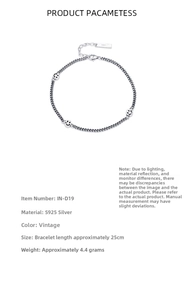 Detail view of S925 sterling silver chain anklet with three retro smile charms and sizing