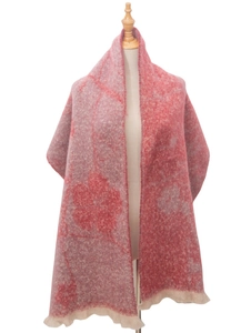 Detail of red floral boucle jacquard scarf with decorative soft tassel edges on a mannequin