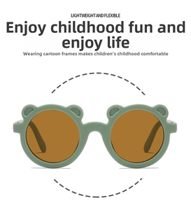 Detail view of bear-shaped green kids sunglasses with lightweight flexible resin frames