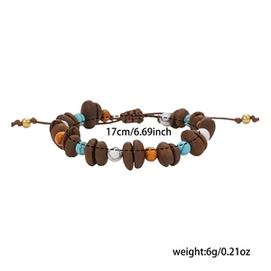 Detailed view of handmade beaded bracelet with brown coffee beans and blue beads