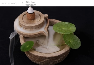 Stone mill style ceramic backflow incense burner showing smoke flowing like water waterfall