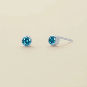 Minimalist sky blue gemstone stud earrings in polished silver setting for women