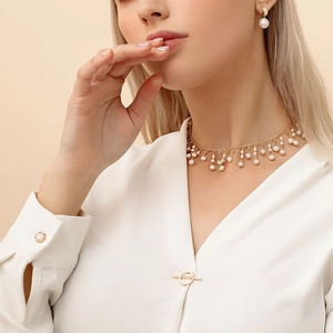 Handmade freshwater pearl necklace and earring set in gold for elegant women's wear