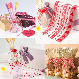 Romantic red heart print ribbon on white background for wedding and gift packaging