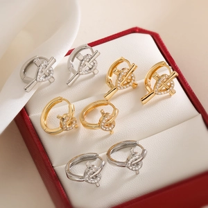 Set of four 18K gold and silver plated cross hoop earrings with zircons in a red gift box
