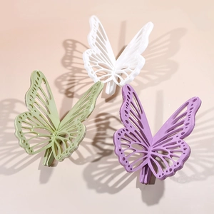 Dreiteiliges Set mit mattierten hohlen Schmetterlings-Haarspangen in Pastellfarben