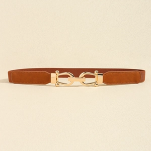 Detail of a brown elastic belt featuring golden interlock U-buckle and PU leather ends