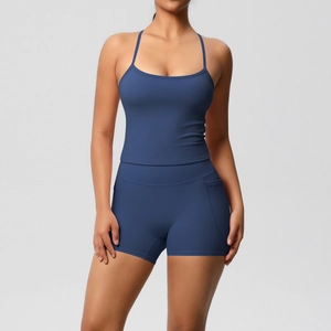 Detail view of high-waist navy yoga shorts featuring functional side pockets and seams