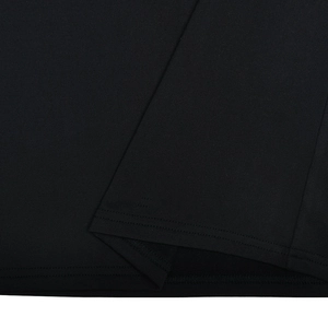 Close-up of the double-needle hem stitching on a black knitted slim-fit dress