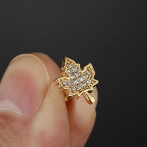 Golden maple leaf stud earring in titanium steel with sparkling cubic zirconia inlay