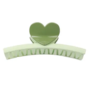 Sweet green heart-shaped claw clip for hair styling with matte and glossy finish