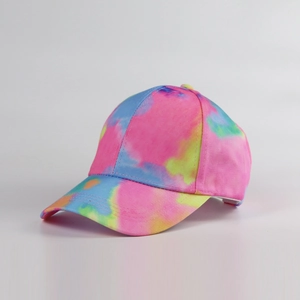 Detail showing colorful tie-dye patterns and fine stitching on a curved brim baseball cap