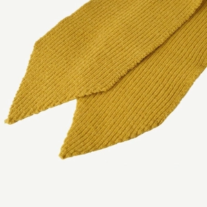 Detail shot of yellow knitted scarf featuring swallowtail cut and fine ribbed texture