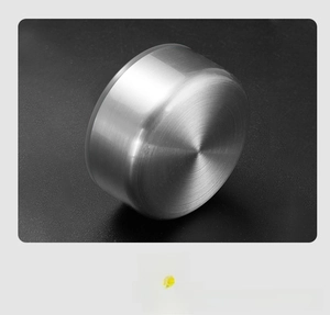 Close-up of glass water bottle inner lid with stainless steel finish and silicone seal